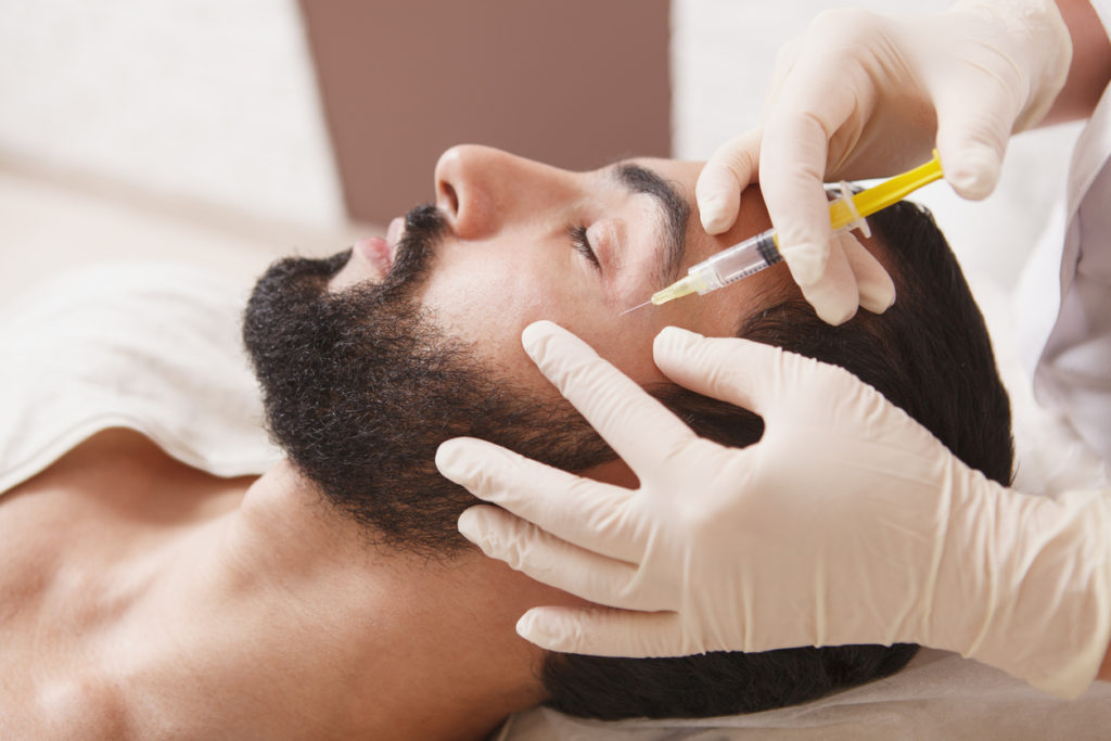 botox injection into man's cheek